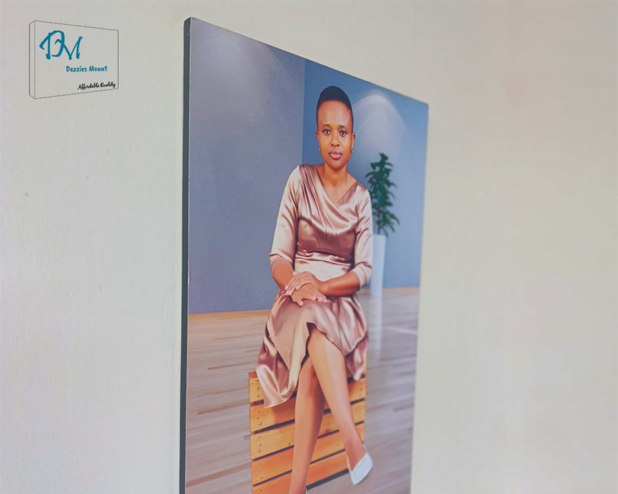 A mounted portrait photo on a wall